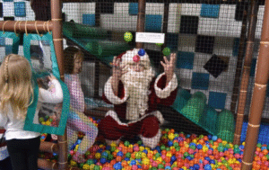 Santa playing in the ballpit